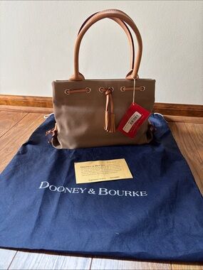 Dooney & Bourke Taupe Leather/Canvas Mini Tassel Tote
tag/reg. card
Used once.